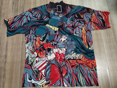 street wear tunic top with an intricate, colorful graphic print featuring Batman and Robin, laid flat on a light wood floor.